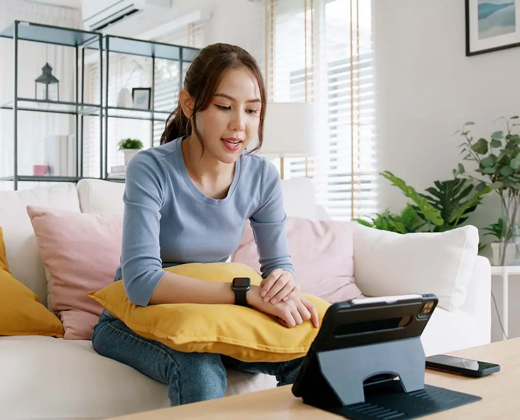Remote therapy - KLS Collective Therapy Group Asian woman in front of screen for therapy